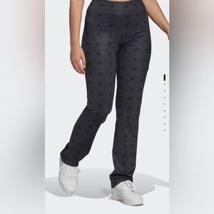 Adidas original stretchy pants. All over logos. Dark blue grey. Medium